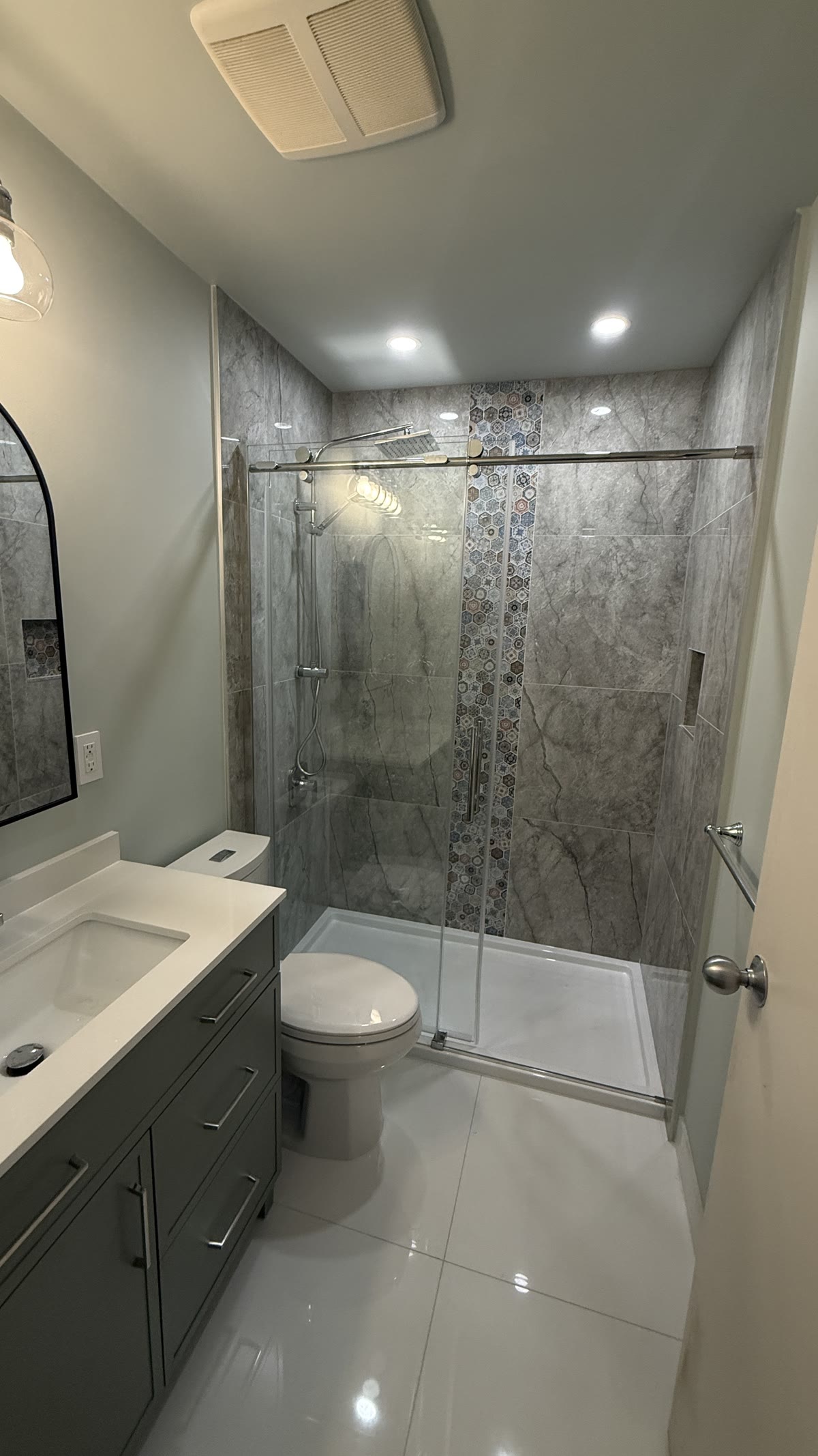 Completed New Westminster bathroom renovation with walk-in shower and glass enclosure