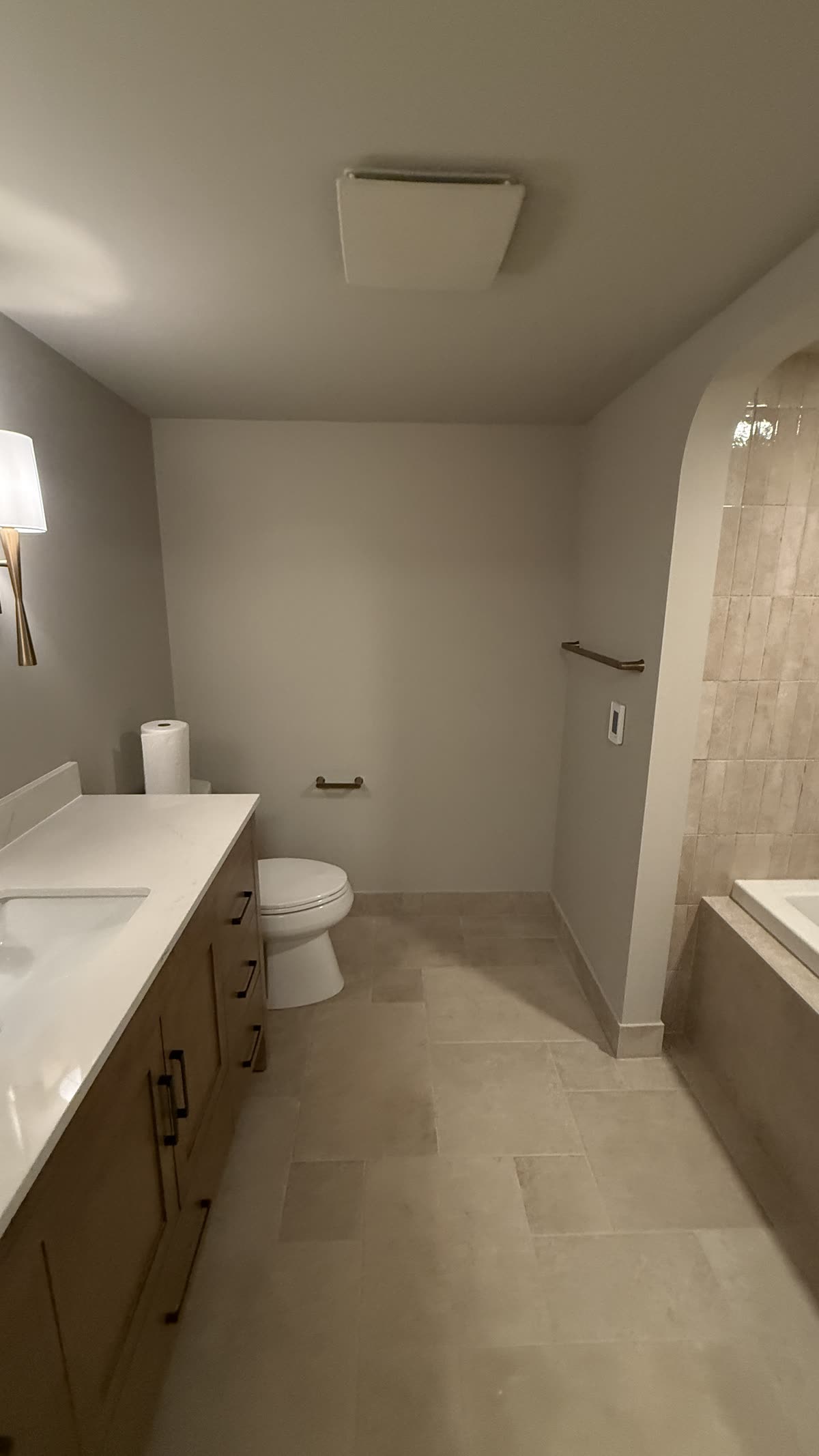 Renovated Vancouver bathroom with heated tile floor and new vanity