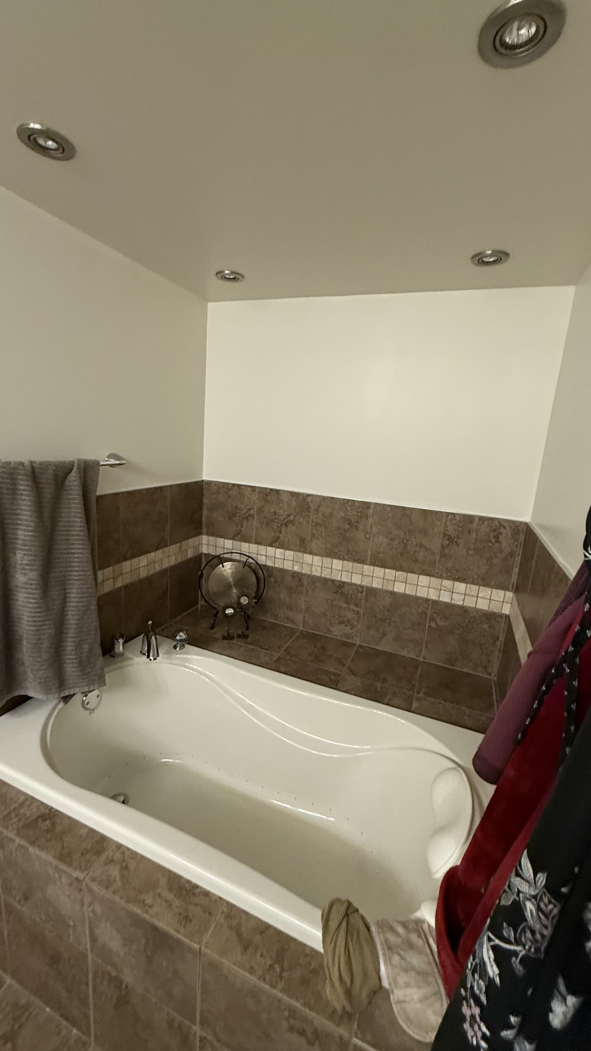 Original tiled bathtub surround before renovation in Vancouver