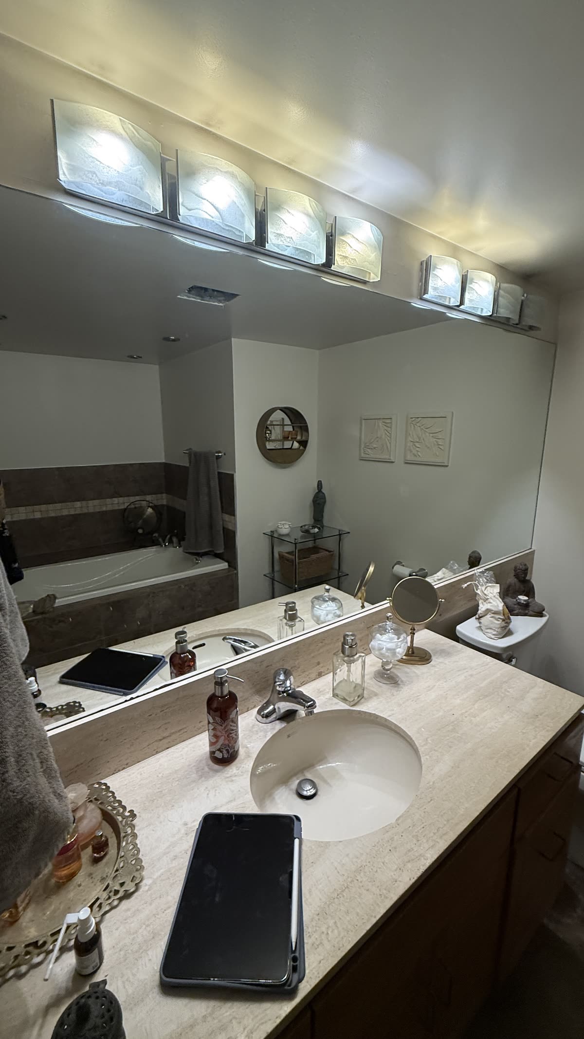 Original vanity and bathtub room before full renovation